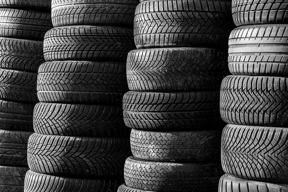 Stack of clean car tires ready for seasonal storage
